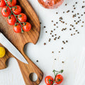black pepper tomatos on cutting board